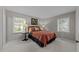 Comfortable bedroom with soft carpet and well-lit windows at 1040 Ivy Ln, Cary, NC 27511