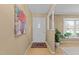 Bright entryway featuring hardwood floors, fresh paint and updated lighting fixtures at 1040 Ivy Ln, Cary, NC 27511