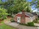 Charming home with red brick chimney and a spacious backyard with room for outdoor activities at 1040 Ivy Ln, Cary, NC 27511