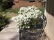 A blooming flower bush enhances the curb appeal of this outdoor living space at 1040 Ivy Ln, Cary, NC 27511