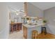 Eat-in kitchen featuring a bar area and bright natural light at 1040 Ivy Ln, Cary, NC 27511