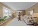 Comfortable living room with hardwood floors, bay window, neutral paint and cozy seating at 1040 Ivy Ln, Cary, NC 27511