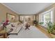 Cozy living room featuring hardwood floors, neutral paint, bay window and stylish decor at 1040 Ivy Ln, Cary, NC 27511