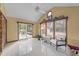 Bright sunroom with vaulted ceilings and access to outdoor deck at 1040 Ivy Ln, Cary, NC 27511