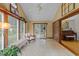 Cozy sunroom with tile flooring, vaulted ceiling, and natural light at 1040 Ivy Ln, Cary, NC 27511