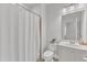 Bathroom with shower, white vanity and ample lighting at 10511 Sablewood Dr # 107, Raleigh, NC 27617