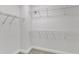 Walk-in closet featuring multiple rows of white wire shelving for ample storage at 10511 Sablewood Dr # 107, Raleigh, NC 27617