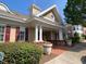 Attractive community clubhouse featuring red brick accents, manicured landscaping, and welcoming entrance at 10511 Sablewood Dr # 107, Raleigh, NC 27617