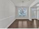 Inviting dining area features dark hardwood floors, neutral walls, and a stylish chandelier at 10511 Sablewood Dr # 107, Raleigh, NC 27617