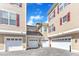 Exterior view shows multiple attached garages in a courtyard with red shutters at 10511 Sablewood Dr # 107, Raleigh, NC 27617