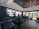 Community gym with modern treadmills and large windows providing ample natural light at 10511 Sablewood Dr # 107, Raleigh, NC 27617