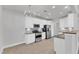 Bright, modern kitchen with stainless appliances and chandelier lighting at 10511 Sablewood Dr # 107, Raleigh, NC 27617