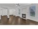 Spacious living room featuring a fireplace, hardwood floors, and natural light at 10511 Sablewood Dr # 107, Raleigh, NC 27617