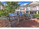 Close up of outdoor kitchen with multiple grills in a red brick patio area at 10511 Sablewood Dr # 107, Raleigh, NC 27617