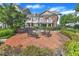 Exterior view shows the community patio with an outdoor kitchen, fire pit, and seating at 10511 Sablewood Dr # 107, Raleigh, NC 27617