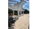 Shaded pergola area with tables and chairs, offering a relaxing outdoor space near the pool at 10511 Sablewood Dr # 107, Raleigh, NC 27617