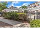 View of pool area through decorative pergola and black metal fence at 10511 Sablewood Dr # 107, Raleigh, NC 27617