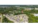 Expansive aerial view of a well-maintained townhouse community with plentiful parking and landscaping at 1076 Kelso Ln, Burlington, NC 27215