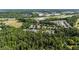 Overhead image of townhouse community nestled amid lush trees in serene location near the highway at 1076 Kelso Ln, Burlington, NC 27215