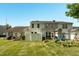Fenced backyard with patio, play set, and well-maintained lawn, perfect for outdoor enjoyment at 1076 Kelso Ln, Burlington, NC 27215