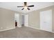 Spacious bedroom with plush carpeting and an attached ensuite bathroom at 1076 Kelso Ln, Burlington, NC 27215