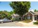 Street view of beautiful townhomes with mature trees and landscaping at 1076 Kelso Ln, Burlington, NC 27215