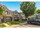 A lovely row of townhomes features brick accents, green lawns, and mature landscaping at 1076 Kelso Ln, Burlington, NC 27215