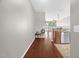 Inviting hallway with wood floors leading to an open-concept living area at 1076 Kelso Ln, Burlington, NC 27215