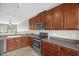 Well-lit kitchen offering stainless steel appliances and ample countertop space at 1076 Kelso Ln, Burlington, NC 27215