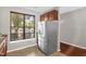 Bright kitchen corner featuring a stainless steel refrigerator and ample natural light at 1076 Kelso Ln, Burlington, NC 27215