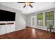 Bright living room offering hardwood floors, access to the backyard, and a ceiling fan at 1076 Kelso Ln, Burlington, NC 27215