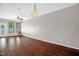 Spacious living room with hardwood floors, natural light, and neutral paint colors at 1076 Kelso Ln, Burlington, NC 27215