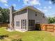 The backyard includes a screened porch and cozy patio with a dining table set at 110 Bonhill Ct, Apex, NC 27502