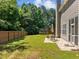 The backyard has a wooden fence for privacy, a trampoline, and a patio at 110 Bonhill Ct, Apex, NC 27502