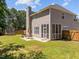 Enjoy outdoor living with a screened porch, patio with table set, and trampoline at 110 Bonhill Ct, Apex, NC 27502