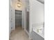 Bathroom featuring a glass shower enclosure, standalone tub, and a large walk-in closet at 110 Bonhill Ct, Apex, NC 27502