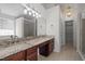 Bathroom with double vanity sinks, lots of counterspace, and glass-enclosed shower at 110 Bonhill Ct, Apex, NC 27502