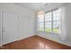Cozy dining area with window views, hardwood floors, and closet space at 110 Bonhill Ct, Apex, NC 27502