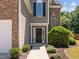 Charming front door and manicured landscaping at 110 Bonhill Ct, Apex, NC 27502