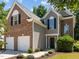 Beautiful two-story home featuring a two-car garage, landscaped yard, and covered entry at 110 Bonhill Ct, Apex, NC 27502