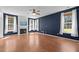 Spacious living room with fireplace and windows providing natural light at 110 Bonhill Ct, Apex, NC 27502
