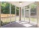 Inviting screened porch with a ceiling fan, perfect for outdoor relaxation at 110 Bonhill Ct, Apex, NC 27502
