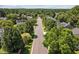 The street view shows well maintained homes surrounded by mature trees at 110 Bonhill Ct, Apex, NC 27502