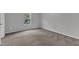 Bedroom featuring neutral carpet, gray walls, natural light, and a window view of trees at 111 Rhino Bnd, Oxford, NC 27565