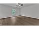 Bright bedroom with hardwood floors, a large window and fresh neutral paint at 111 Rhino Bnd, Oxford, NC 27565