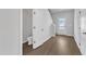 Welcoming entryway featuring beautiful hardwood floors, access to a half bath, and natural light at 111 Rhino Bnd, Oxford, NC 27565