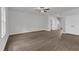 Open-concept living area with ceiling fan, lots of natural light, hardwood floors and a staircase at 111 Rhino Bnd, Oxford, NC 27565