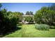 Backyard featuring a partially fenced yard and mature trees at 1122 Birkdale Dr, Mebane, NC 27302