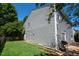 Exterior showing the back yard and vinyl siding at 1122 Birkdale Dr, Mebane, NC 27302