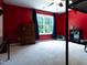 This bedroom offers bright, natural light, comfortable carpet, and a ceiling fan at 1122 Birkdale Dr, Mebane, NC 27302